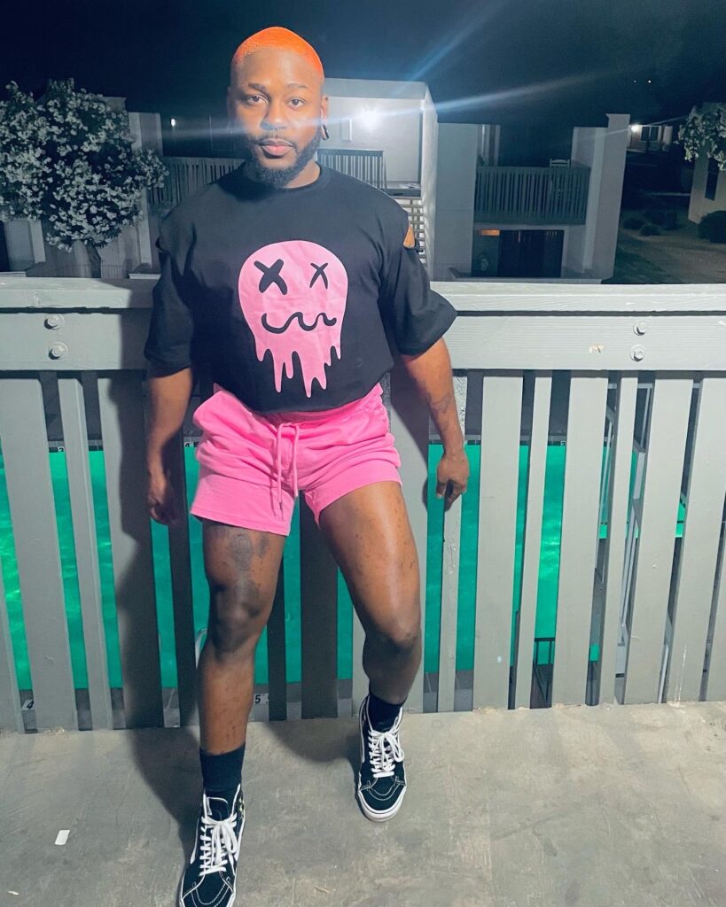 Caliboycutee (@caliboycutee) gay onlyfans model standing wearing black tshirt